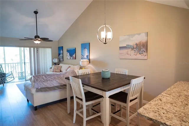 a living room with furniture a couch and a chandelier