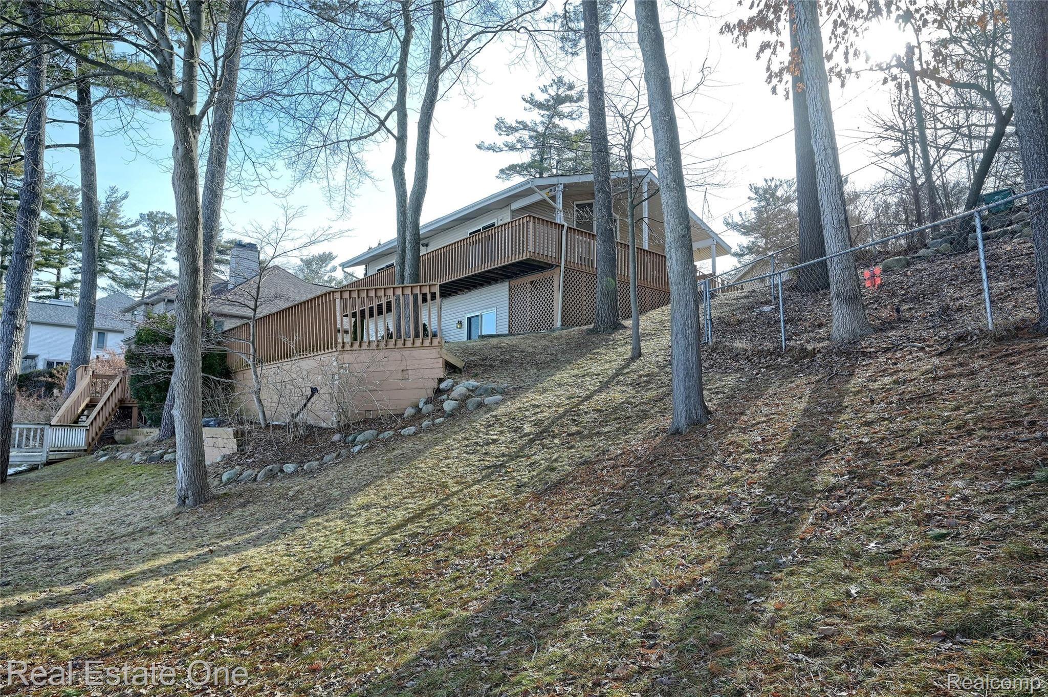 944 Pine Tree Road West Lake Orion, MI 48362 - Photo 56 of 81 Sloped back lot