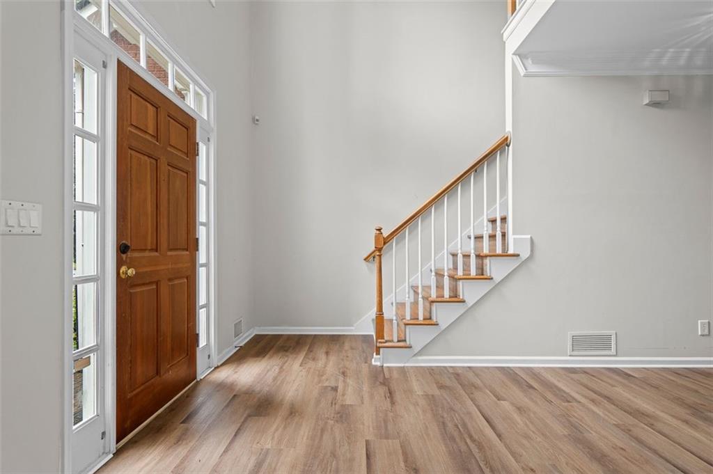 a view of entryway with wooden floor