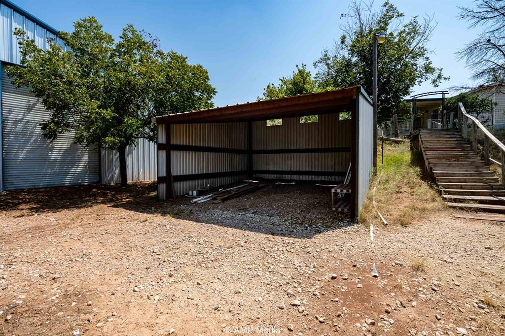 130 County Road 104 Roby, TX 79543 - Photo 27 of 39 a view of backyard with wooden fence and large trees