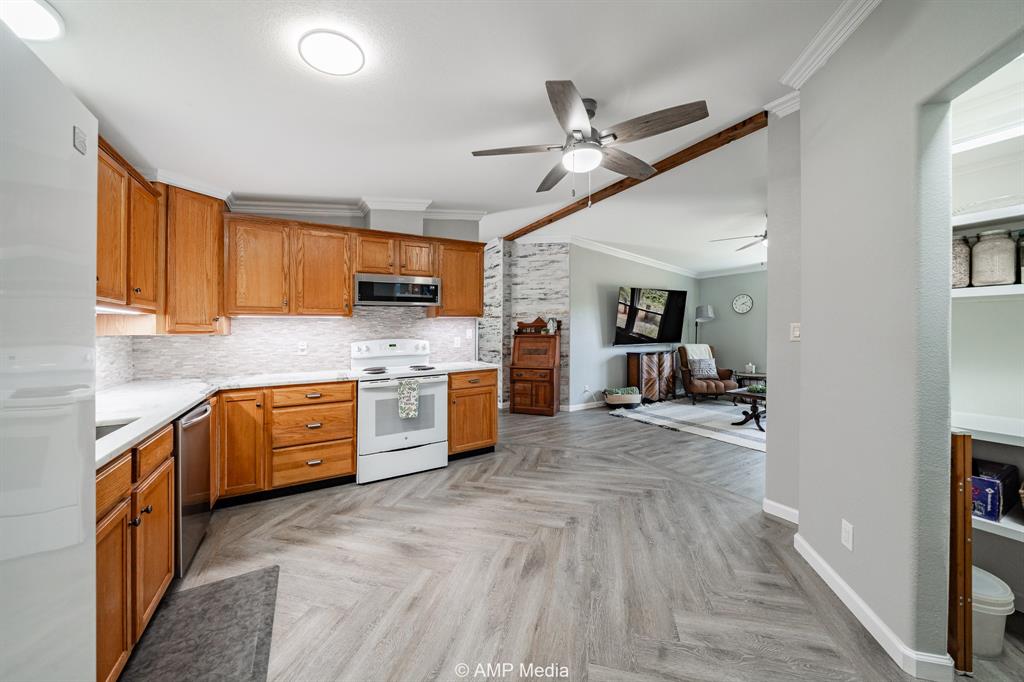 130 County Road 104 Roby, TX 79543 - Photo 31 of 39 a view of a kitchen with a sink cabinets and wooden floor