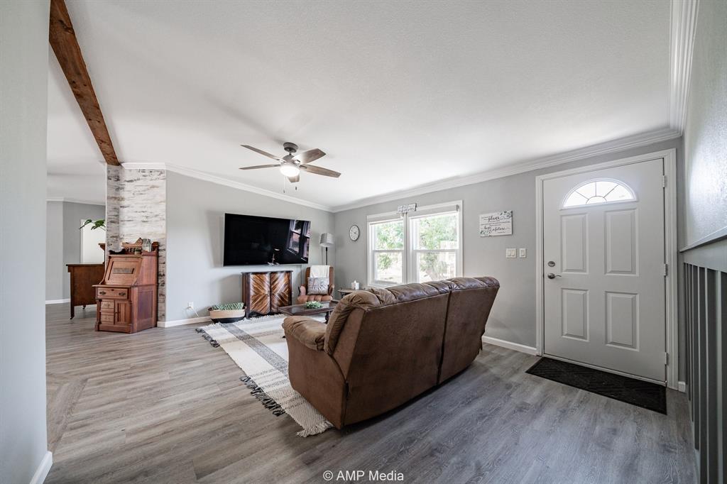 130 County Road 104 Roby, TX 79543 - Photo 32 of 39 a living room with furniture and a flat screen tv