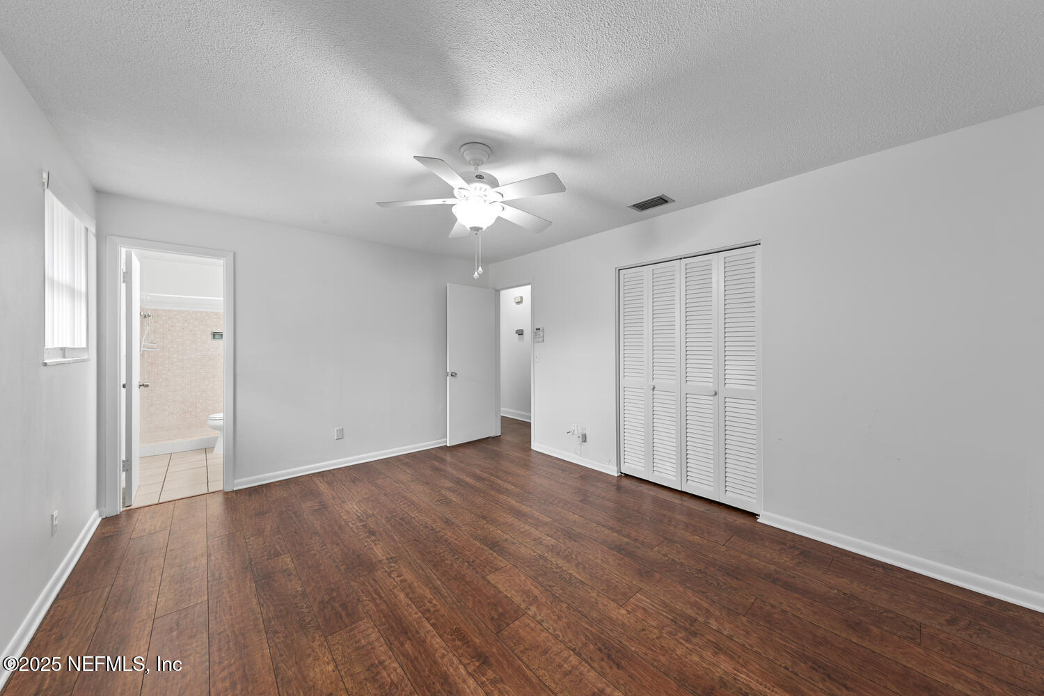 1144 Crown Drive Jacksonville, FL 32221 - Photo 10 of 20 a view of an empty room with wooden floor