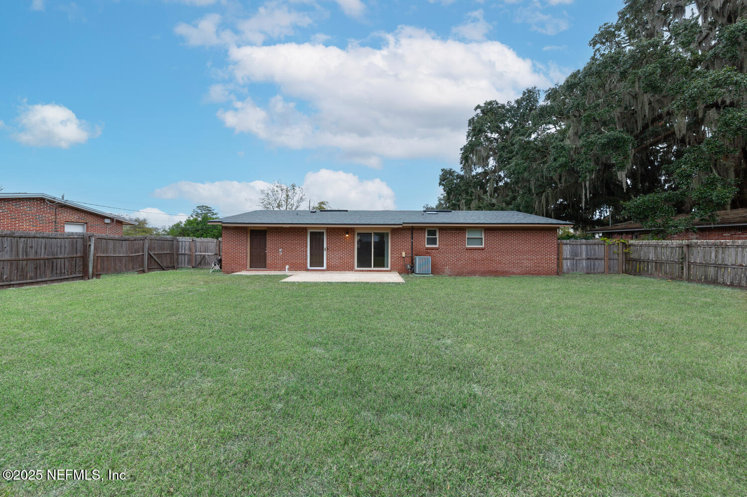 1144 Crown Drive Jacksonville, FL 32221 - Photo 16 of 20 a view of a house with a yard and sitting area