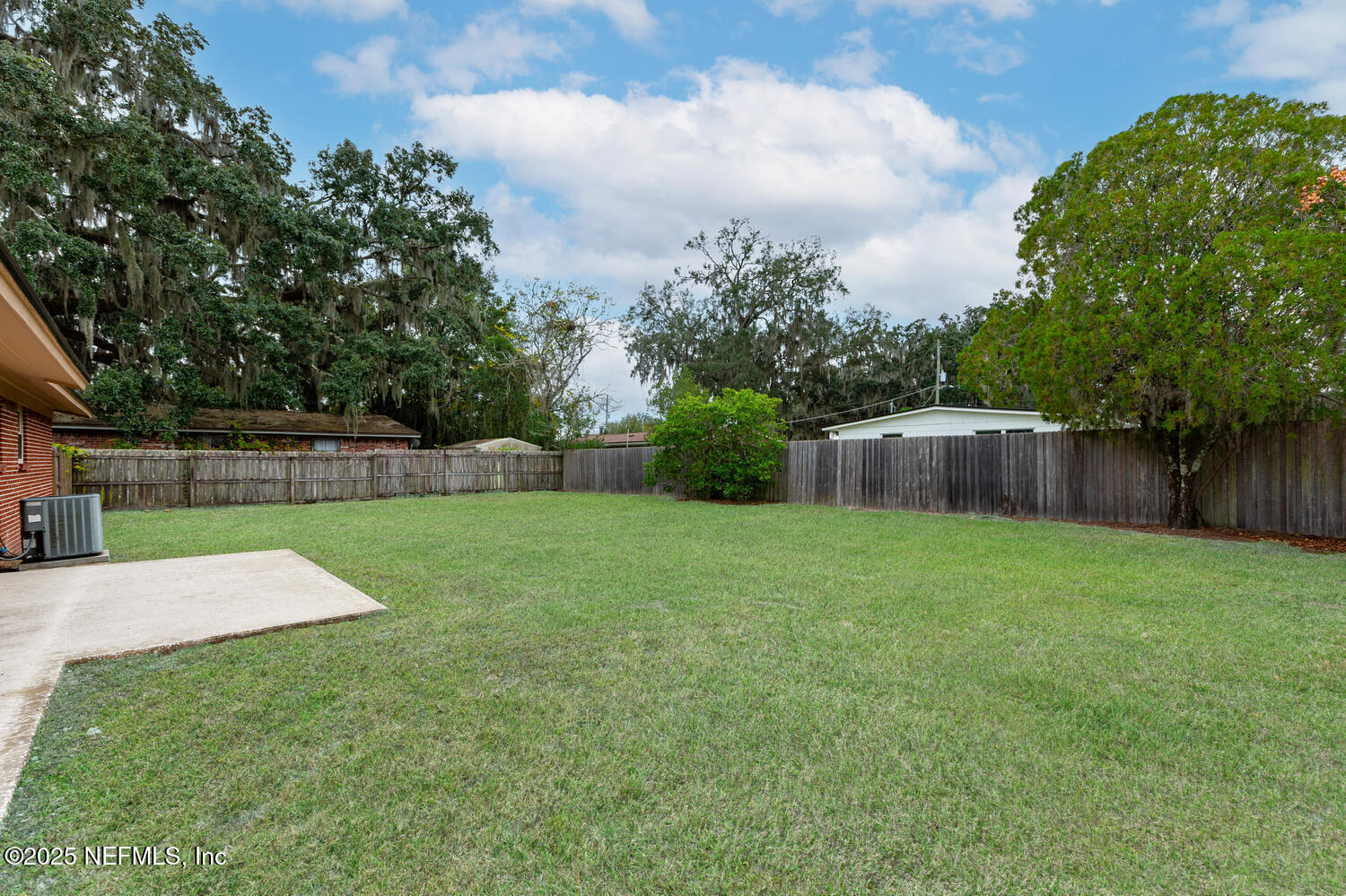 1144 Crown Drive Jacksonville, FL 32221 - Photo 17 of 20 a view of a backyard with green space