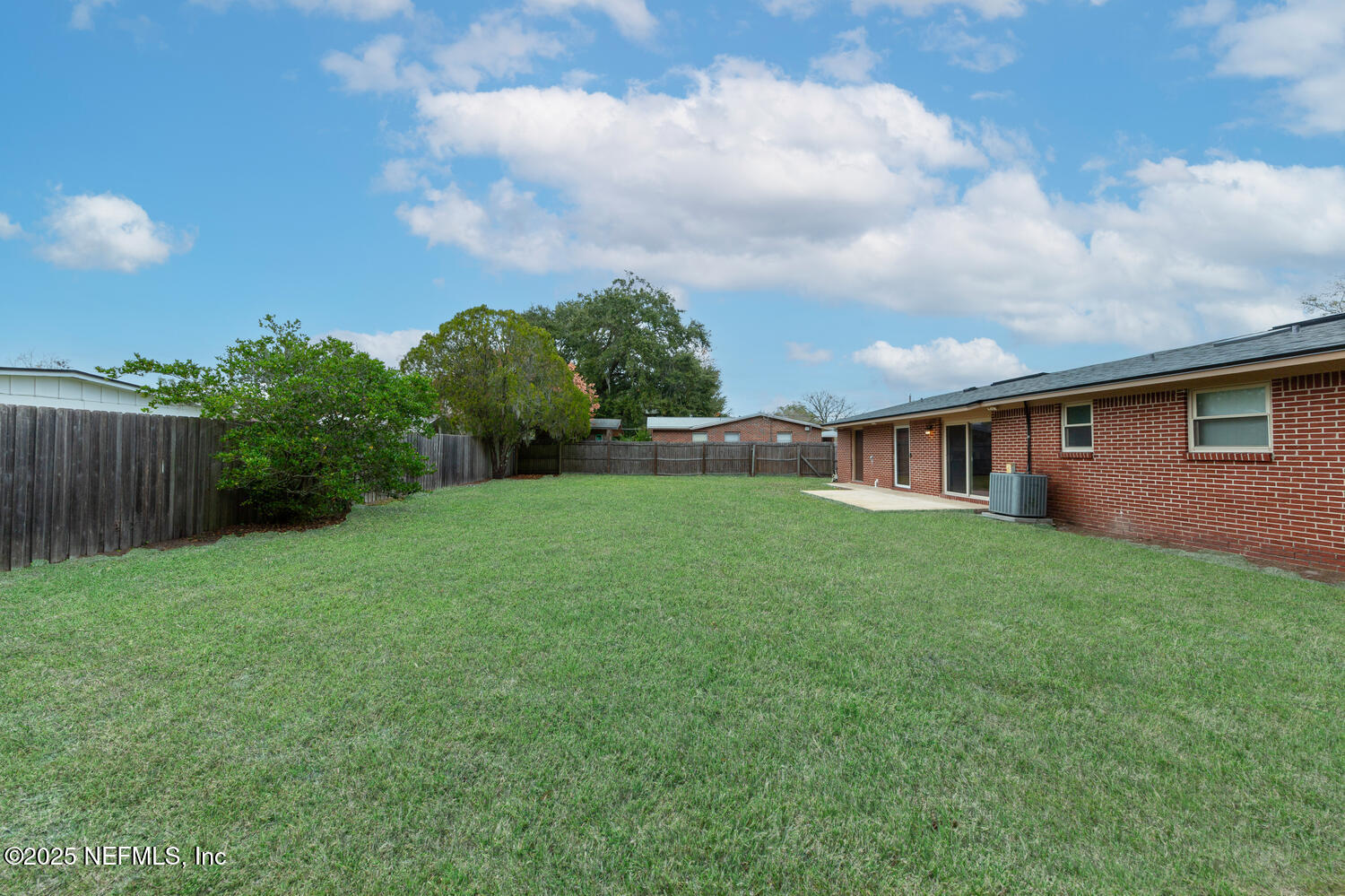 1144 Crown Drive Jacksonville, FL 32221 - Photo 18 of 20 a view of a house with backyard and a garden