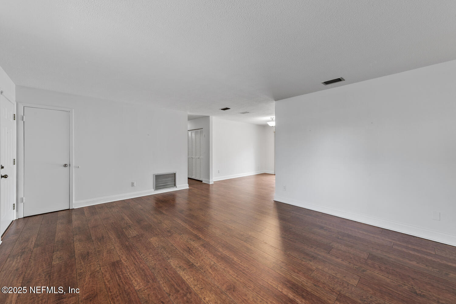 1144 Crown Drive Jacksonville, FL 32221 - Photo 4 of 20 a view of an empty room with wooden floor