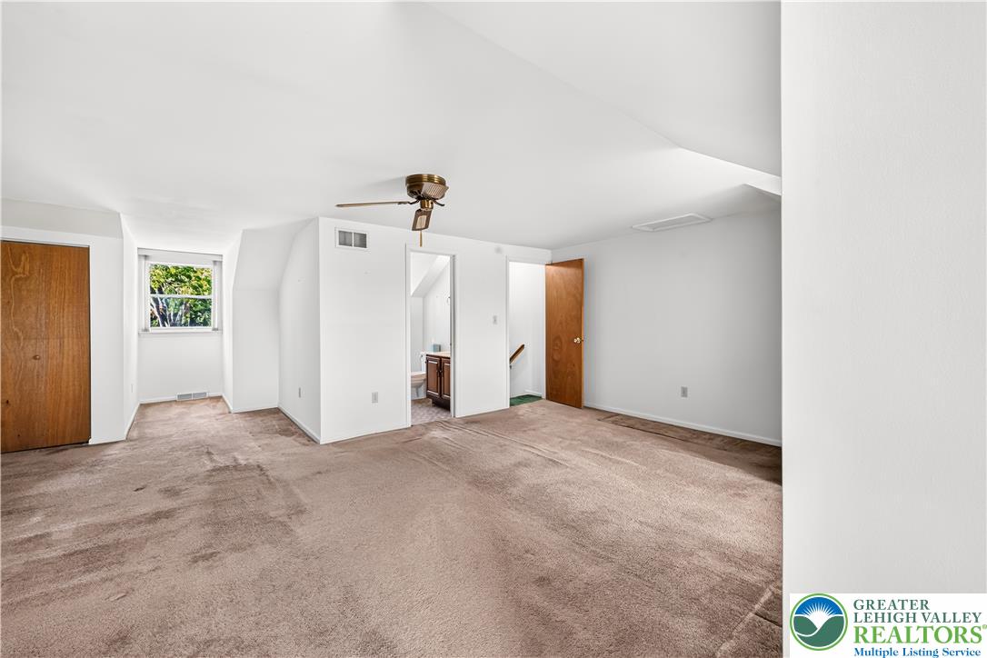 168 Springhouse Road Allentown, PA 18104 - Photo 23 of 49 A spacious secondary room with carpet flooring and ample natural light from the window.