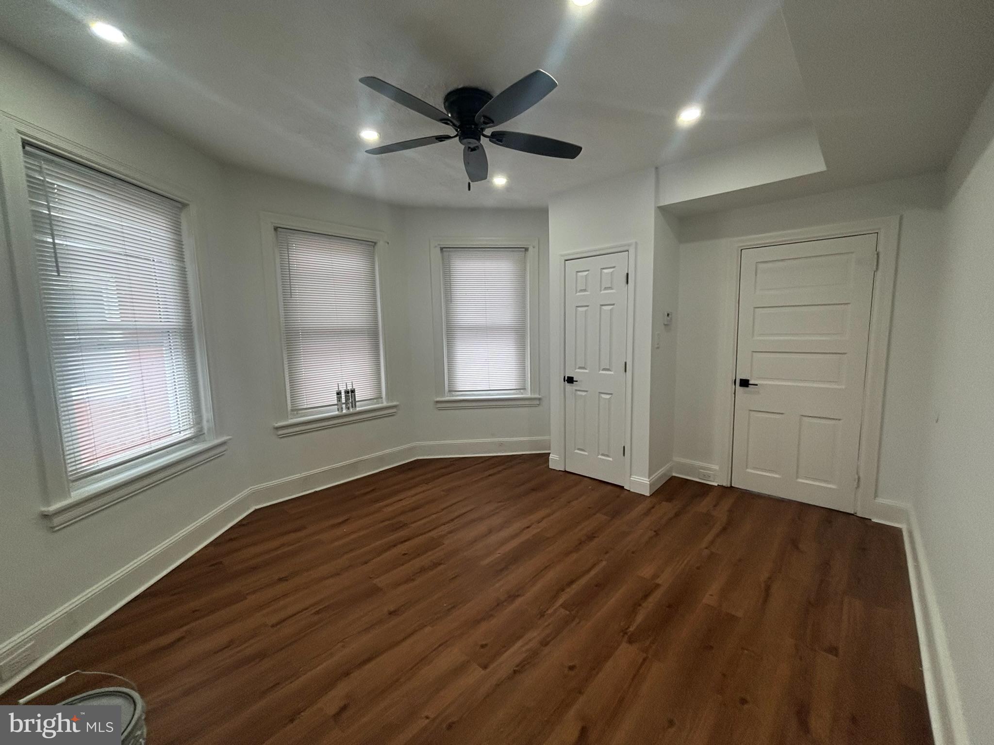 320 Loney Street, Unit (2ND FL) Philadelphia, PA 19111 - Photo 14 of 19 a view of an empty room with wooden floor and a window