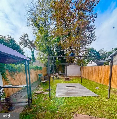 a view of a backyard with swimming pool