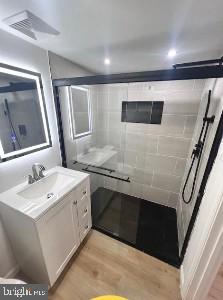 320 Loney Street, Unit (2ND FL) Philadelphia, PA 19111 - Photo 7 of 19 a bathroom with a sink and a mirror