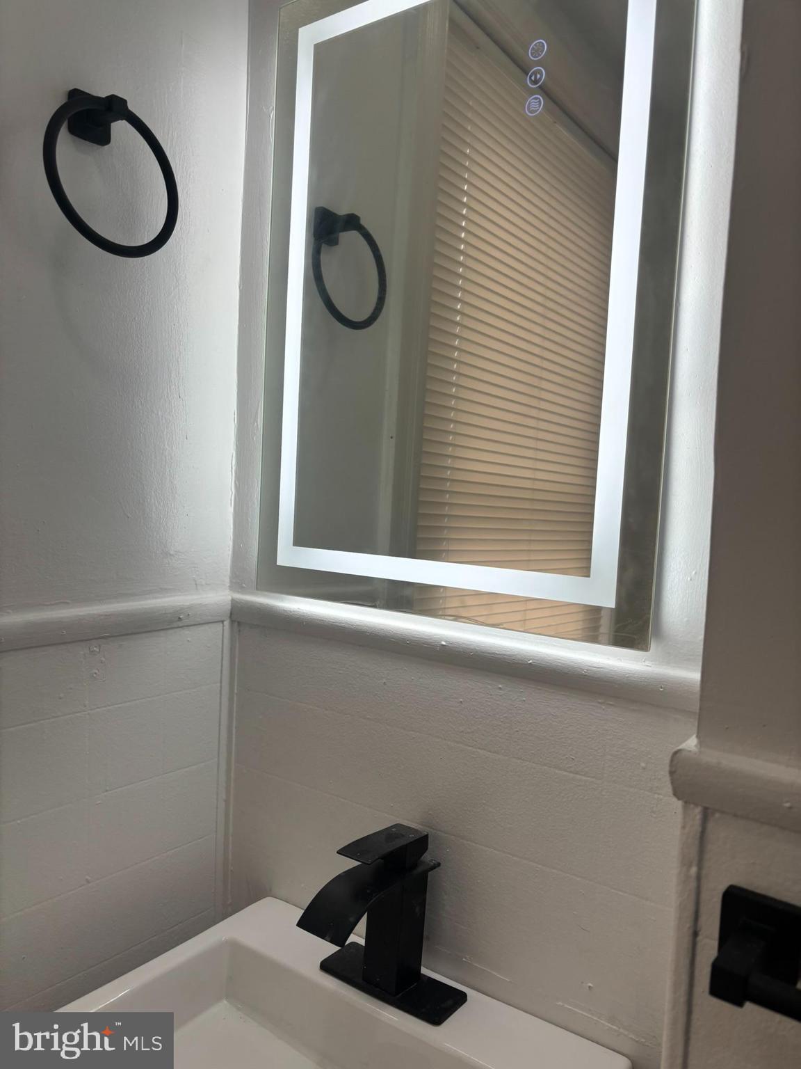320 Loney Street, Unit (2ND FL) Philadelphia, PA 19111 - Photo 9 of 19 a bathroom with a sink and a window
