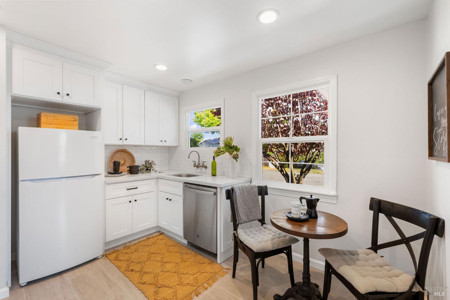 2005 Adrian Street Napa, CA 94559 - Photo 15 of 32 a kitchen with appliances cabinets and chair
