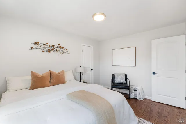 a bedroom with a bed and a lamp