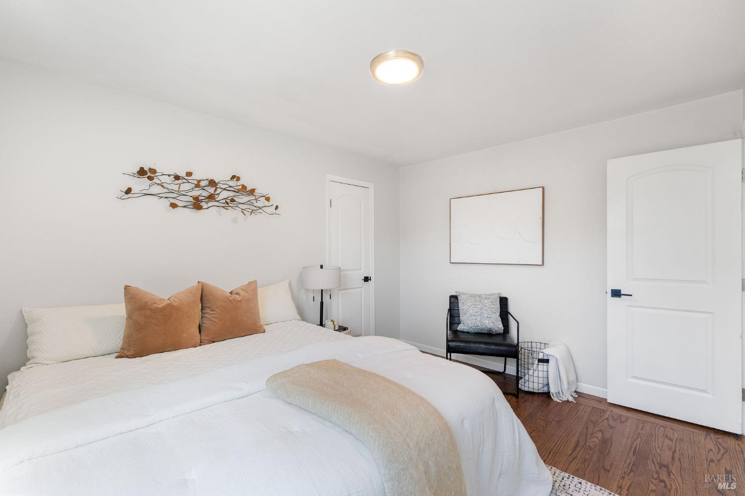 2005 Adrian Street Napa, CA 94559 - Photo 19 of 32 a bedroom with a bed and a lamp