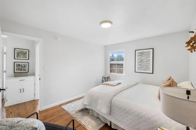 a bedroom with a bed and a couch