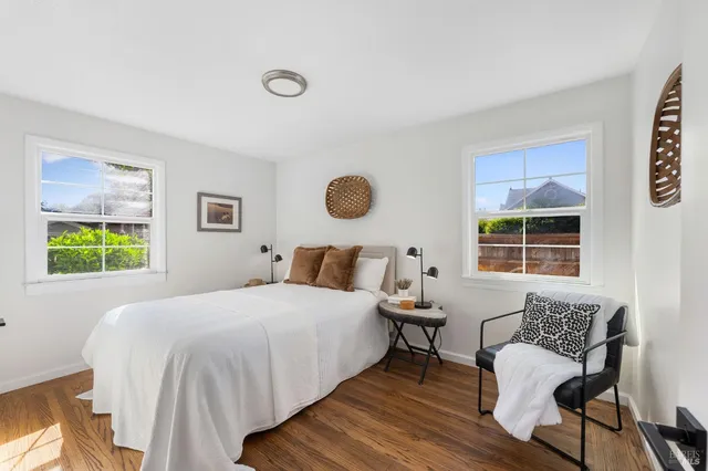 a bedroom with a bed and window