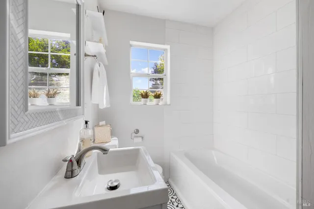 a bathroom with a sink and a bathtub