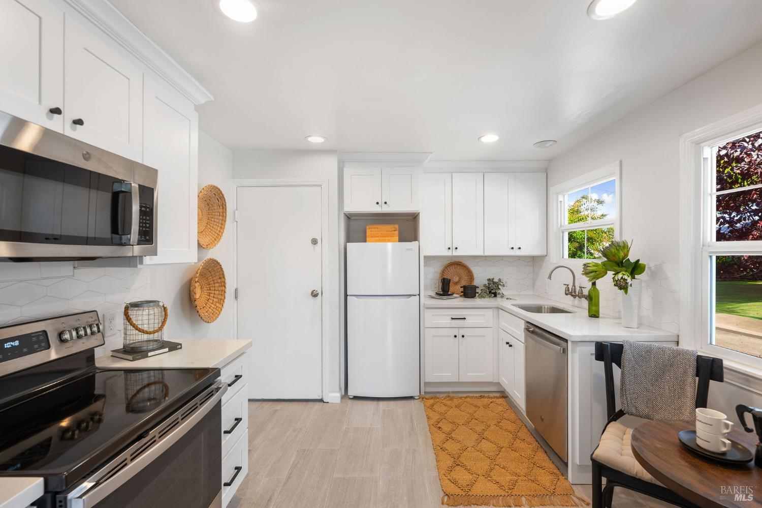 2005 Adrian Street Napa, CA 94559 - Photo 10 of 32 a kitchen with a sink a stove and refrigerator