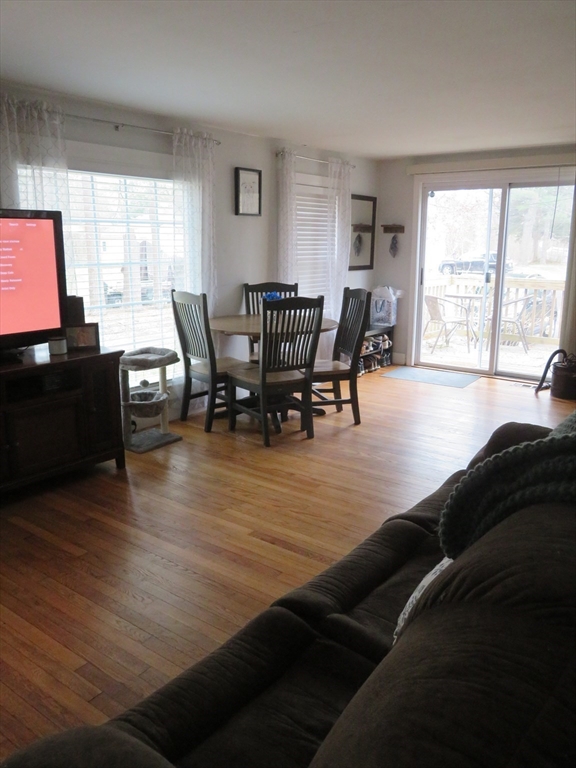 34 R Pine Street Norton, MA 02766 - Photo 5 of 20 a view of a dining room with furniture and wooden floor