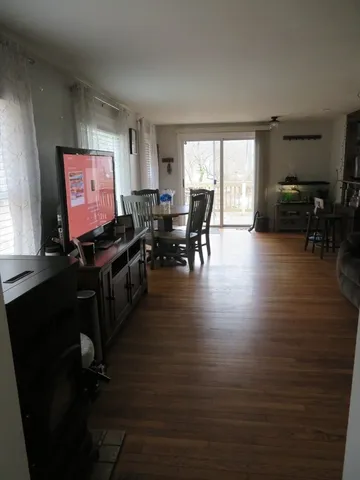a room with wooden floor and furniture