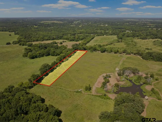 a view of a lake with a yard
