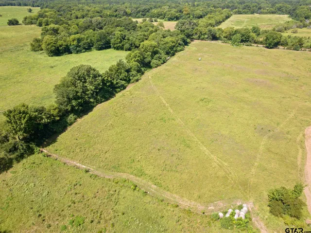 a view of a big yard with an outdoor space