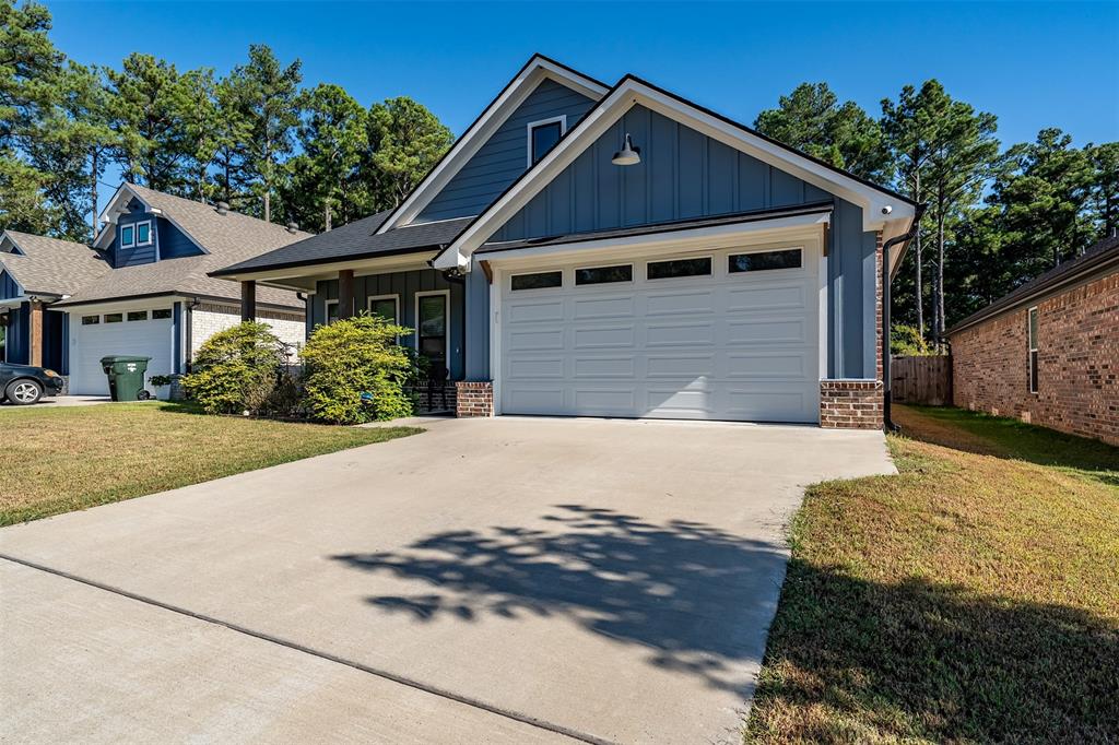 1672 Alamo Xing Road Tyler, TX 75701 - Photo 1 of 25 a front view of a house with a yard
