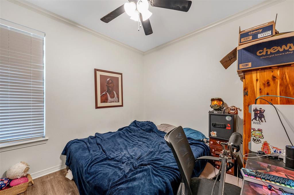 1672 Alamo Xing Road Tyler, TX 75701 - Photo 14 of 25 a bedroom with furniture and a window