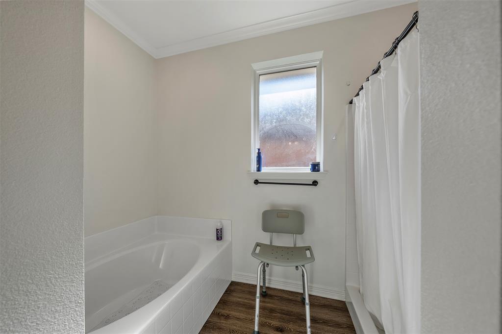 1672 Alamo Xing Road Tyler, TX 75701 - Photo 18 of 25 a bathroom with a sink and a bathtub