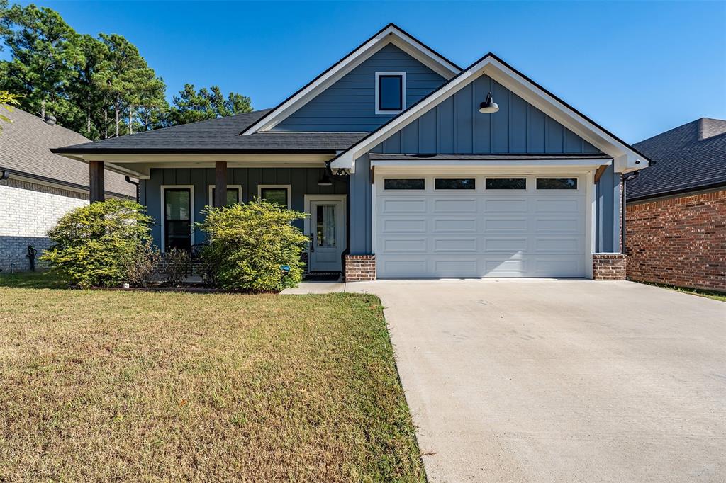 1672 Alamo Xing Road Tyler, TX 75701 - Photo 2 of 25 a front view of a house with garden