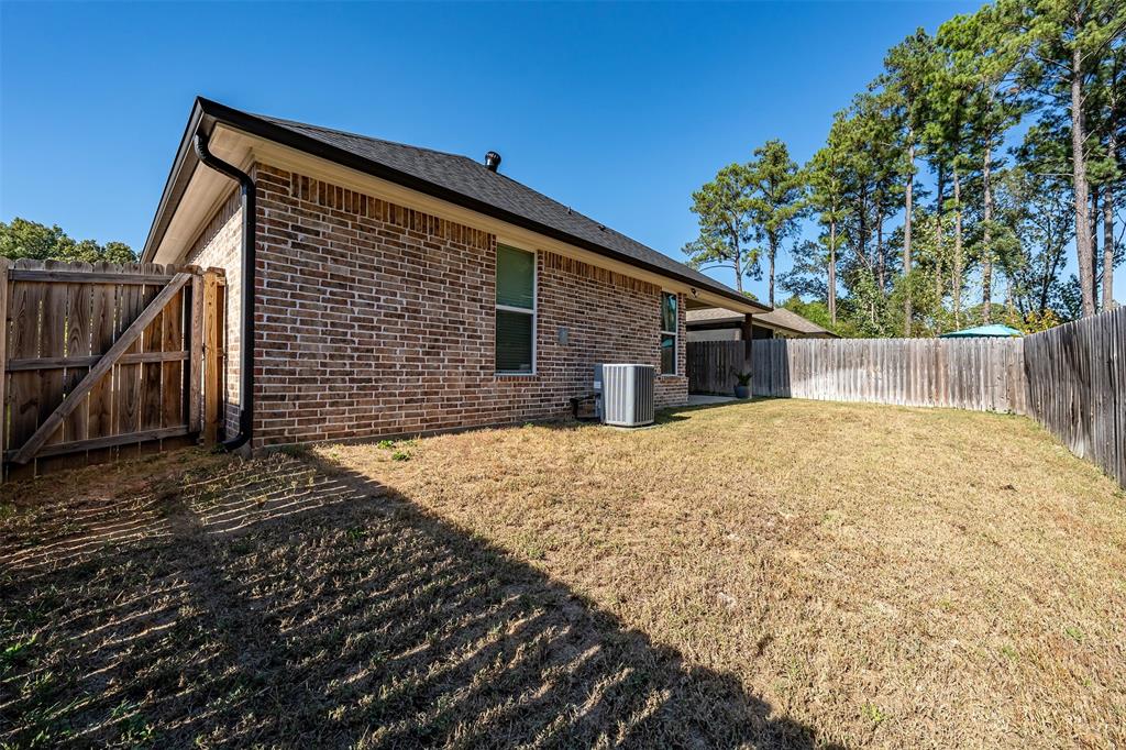 1672 Alamo Xing Road Tyler, TX 75701 - Photo 22 of 25 a backyard of a house