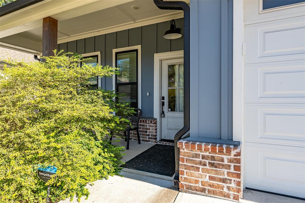 1672 Alamo Xing Road Tyler, TX 75701 - Photo 23 of 25 a front view of a house with a yard