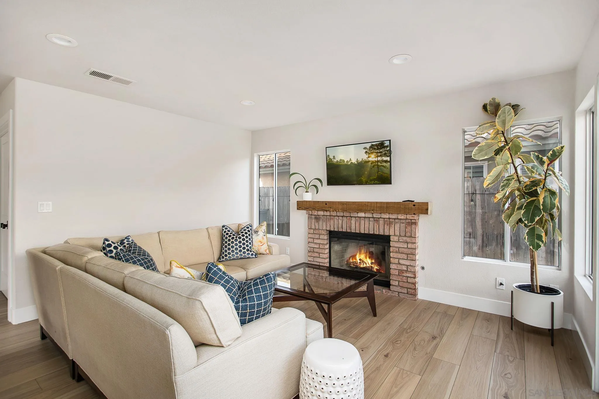 649 Mosaic Circle Oceanside, CA 92057 - Photo 18 of 52 a living room with furniture and a fireplace