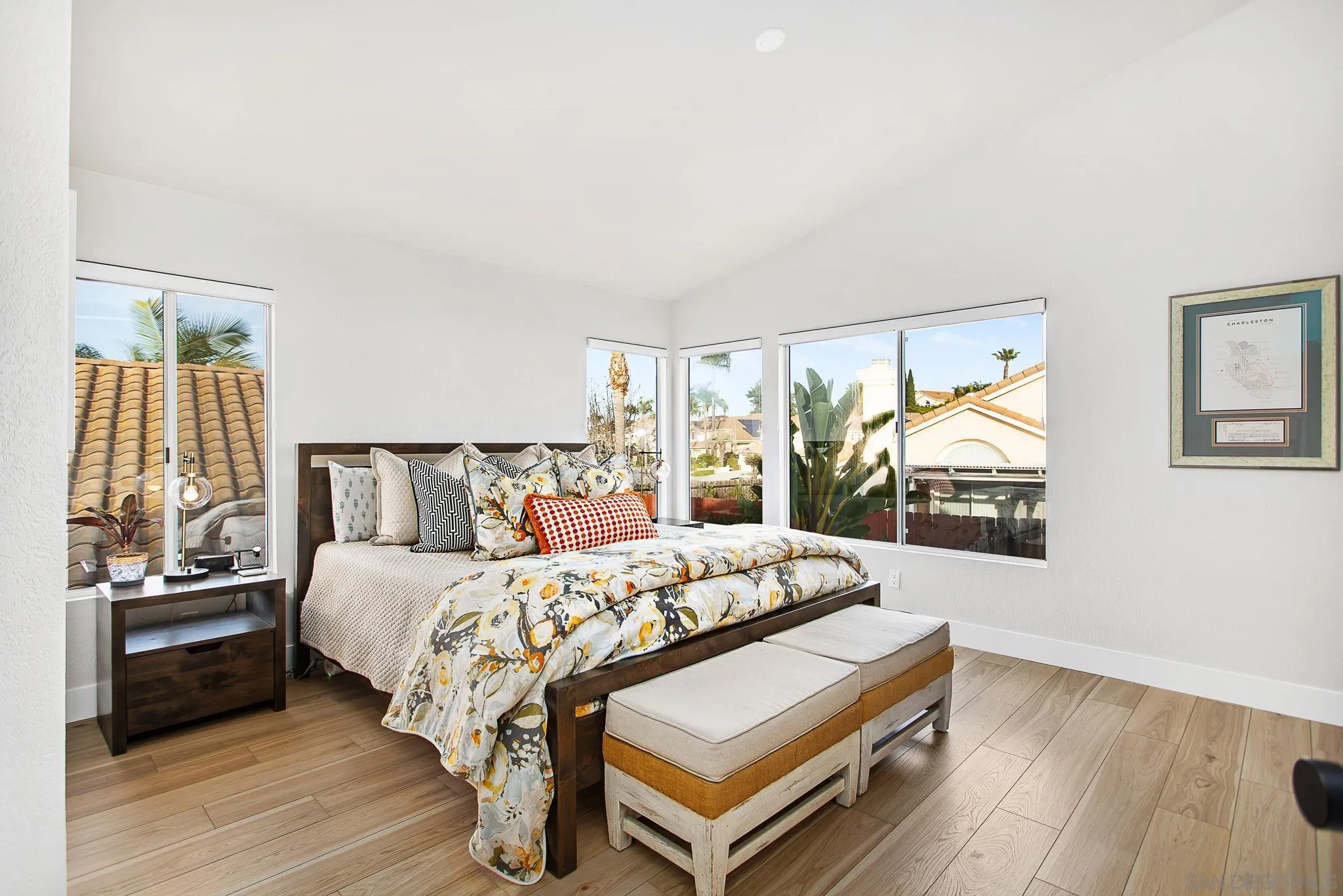 649 Mosaic Circle Oceanside, CA 92057 - Photo 22 of 52 a bedroom with a bed and wooden floor