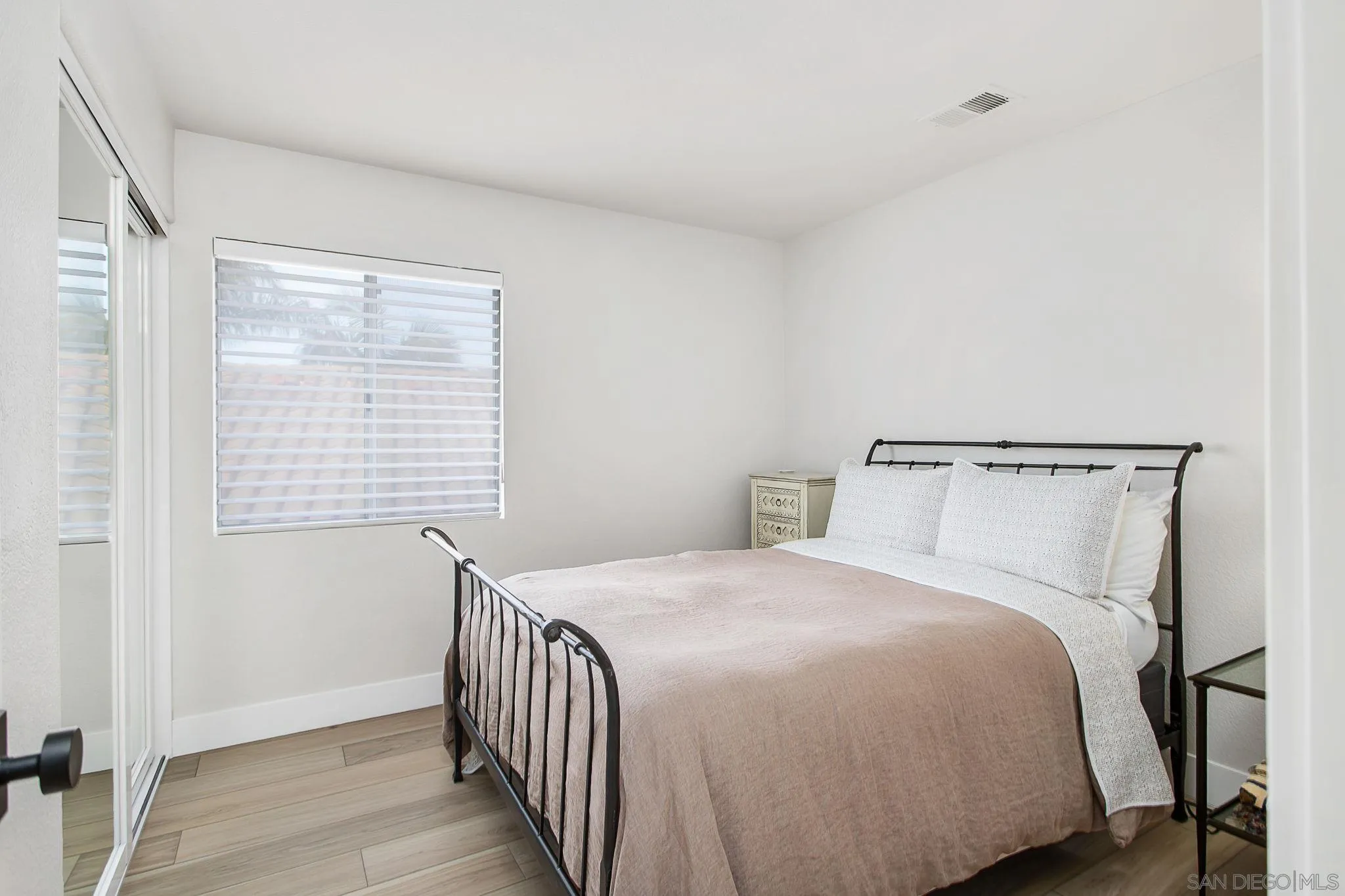 649 Mosaic Circle Oceanside, CA 92057 - Photo 27 of 52 a bedroom with a bed and a window