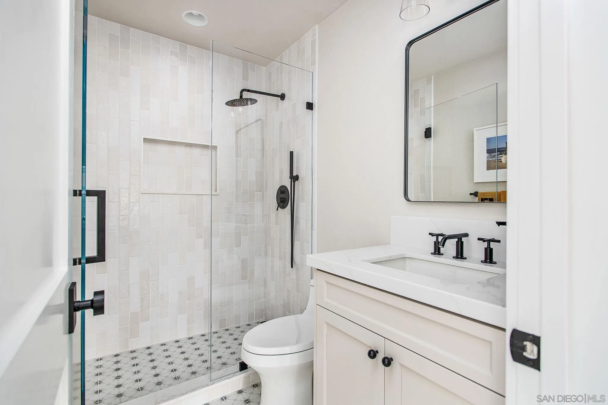 649 Mosaic Circle Oceanside, CA 92057 - Photo 33 of 52 a bathroom with a granite countertop sink toilet and shower