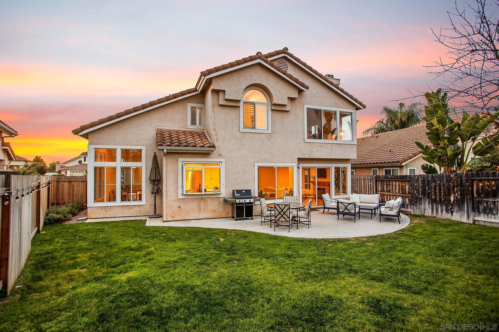 649 Mosaic Circle Oceanside, CA 92057 - Photo 36 of 52 a front view of a house with a garden and patio