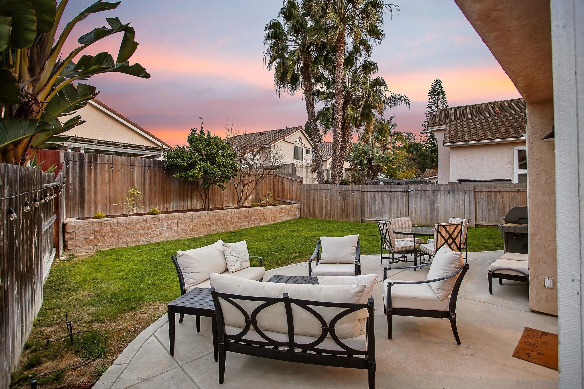 649 Mosaic Circle Oceanside, CA 92057 - Photo 40 of 52 a view of a chairs and table in the back yard of the house