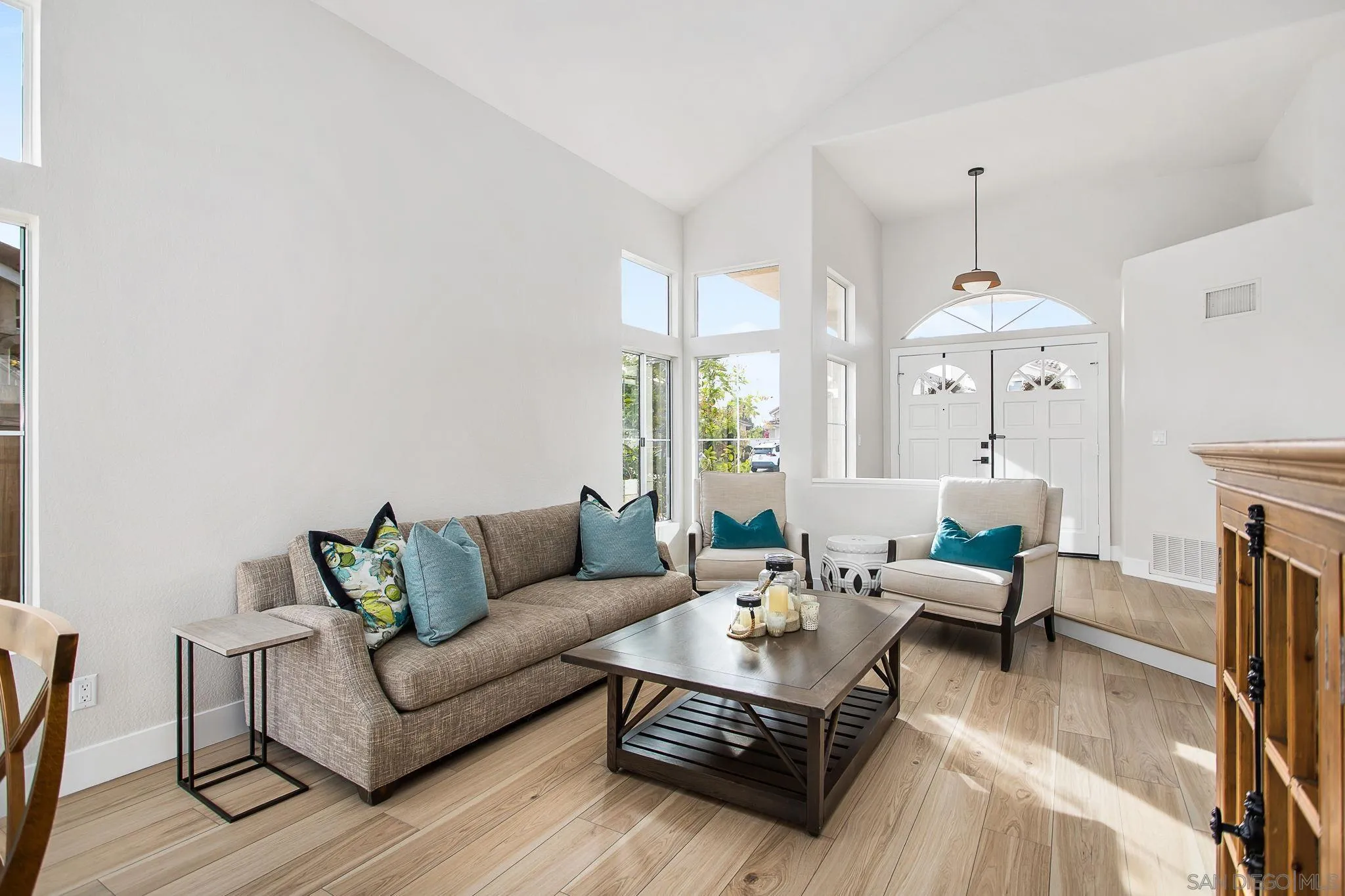 649 Mosaic Circle Oceanside, CA 92057 - Photo 5 of 52 a living room with furniture a fireplace and a chandelier