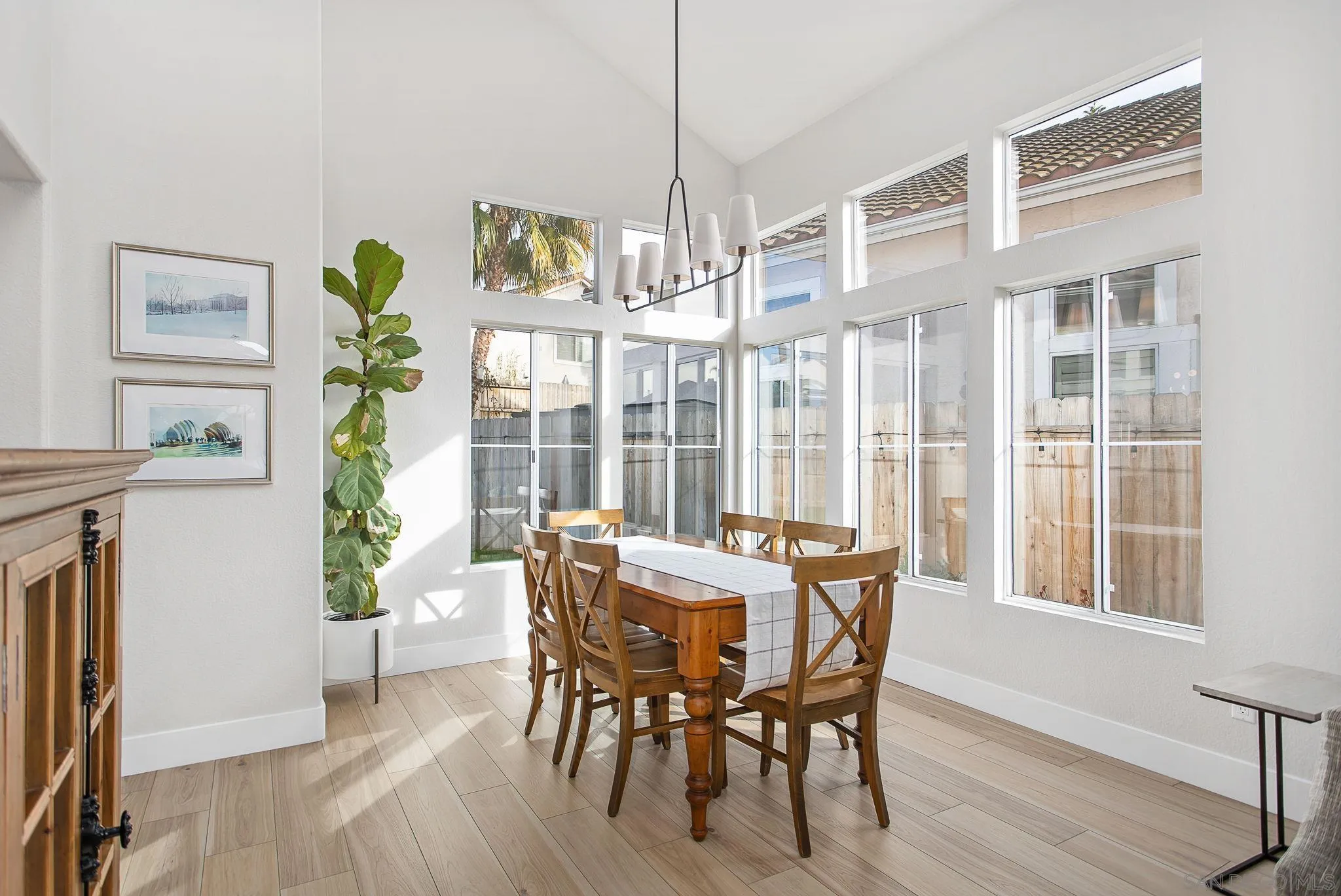 649 Mosaic Circle Oceanside, CA 92057 - Photo 6 of 52 a view of a dining room with furniture window and wooden floor