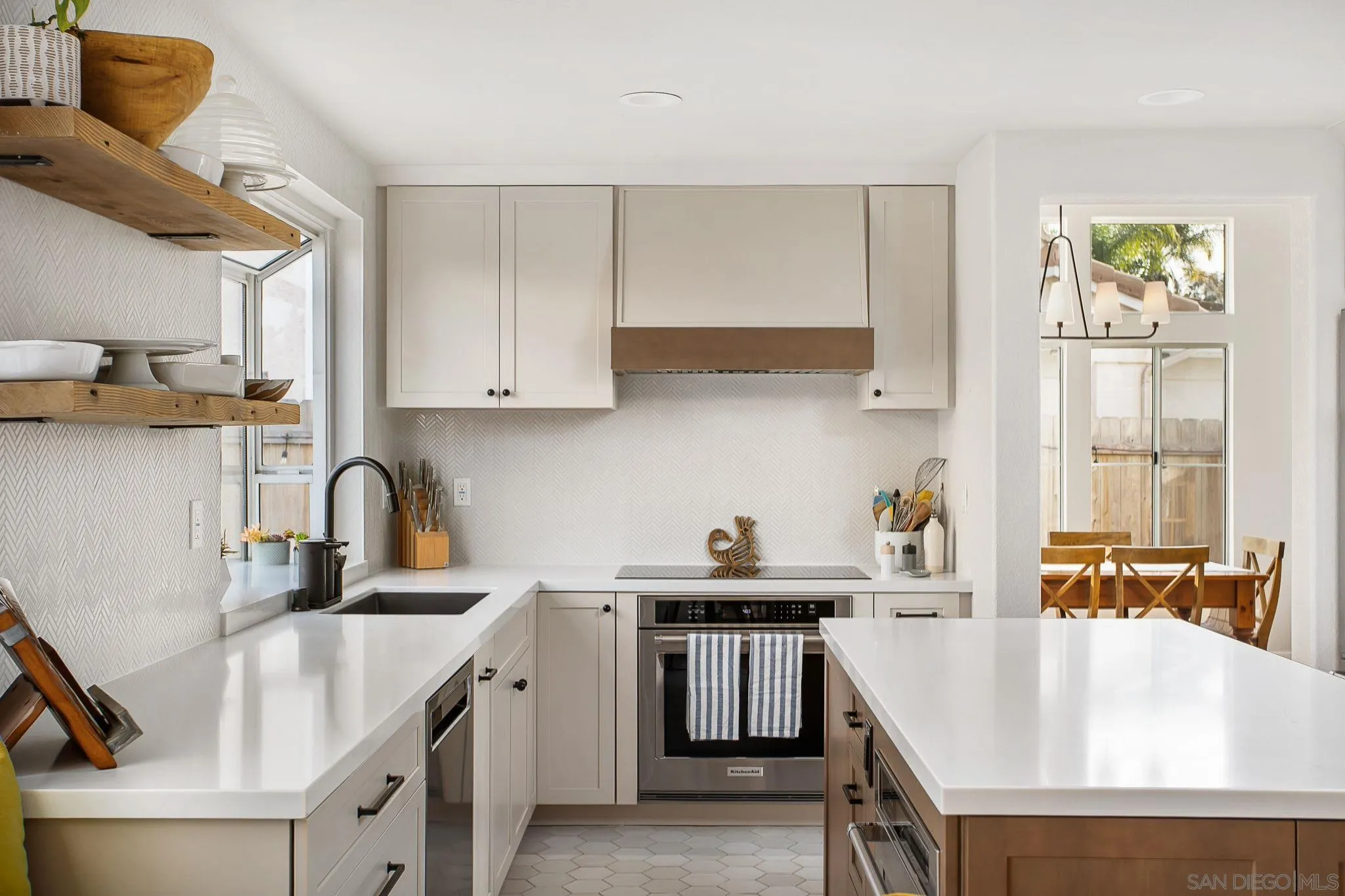 649 Mosaic Circle Oceanside, CA 92057 - Photo 8 of 52 a kitchen with a sink a stove and cabinets