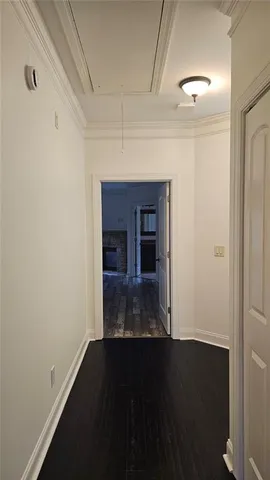 wooden floor in an empty room with a fireplace