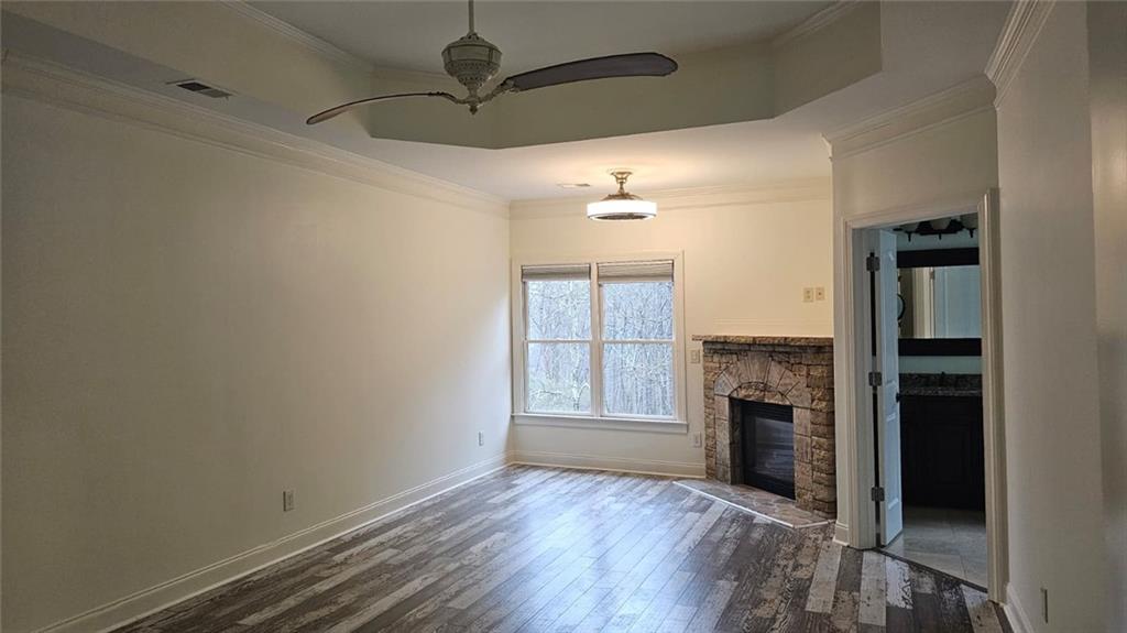 3533 Peacock Road Alpharetta, GA 30004 - Photo 17 of 21 wooden floor in an empty room with a fireplace