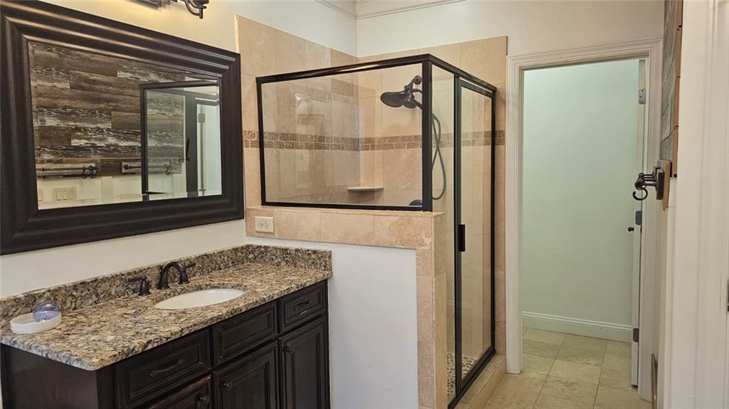3533 Peacock Road Alpharetta, GA 30004 - Photo 21 of 21 a bathroom with a granite countertop sink and a mirror