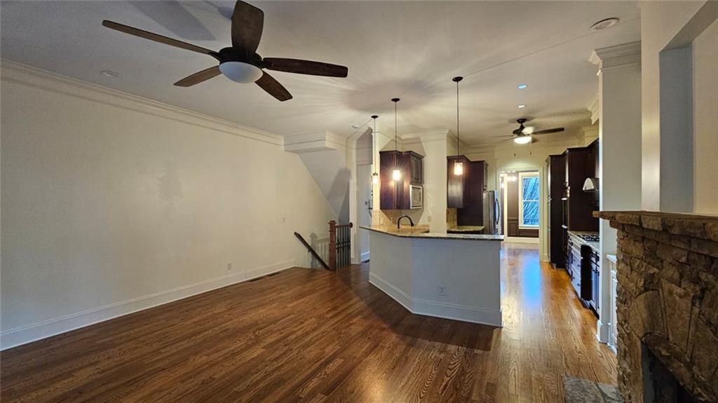 3533 Peacock Road Alpharetta, GA 30004 - Photo 7 of 21 a view of a living room hardwood floor and a ceiling fan