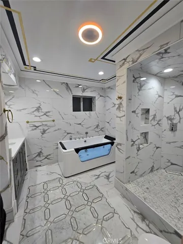 a bedroom with furniture and a flat screen tv