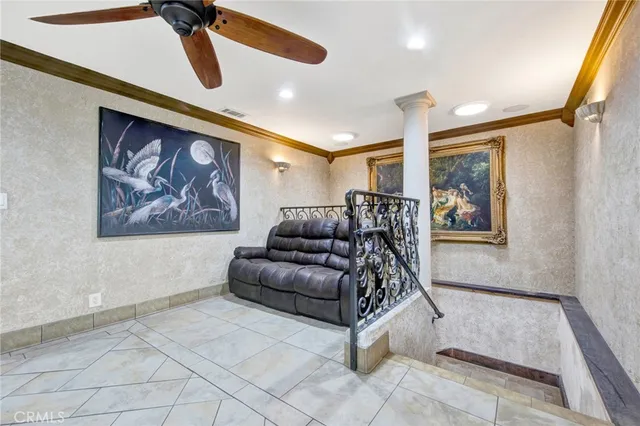 a view of a dining room with furniture and a chandelier