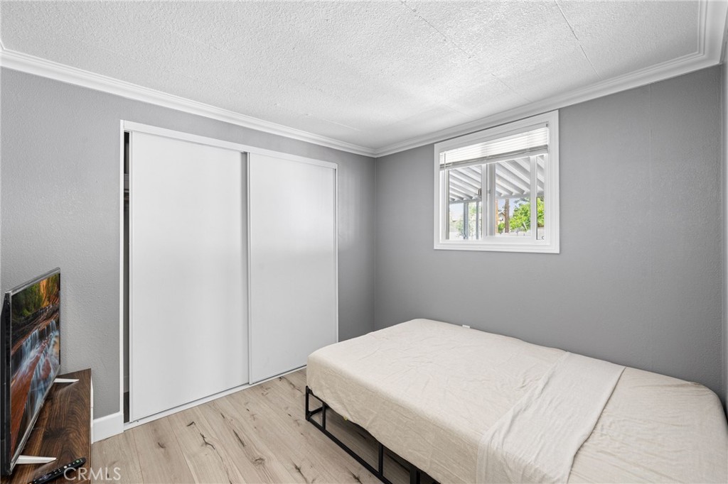 32857 Valley View Avenue Lake Elsinore, CA 92530 - Photo 6 of 12 a bedroom with a bed and a window