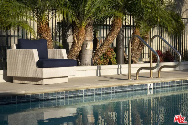 a view of an outdoor sitting area with furniture and backyard